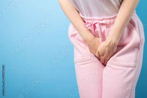 Urinary incontinence, woman holding crotch, female health, chronic disorder, urine leakage.