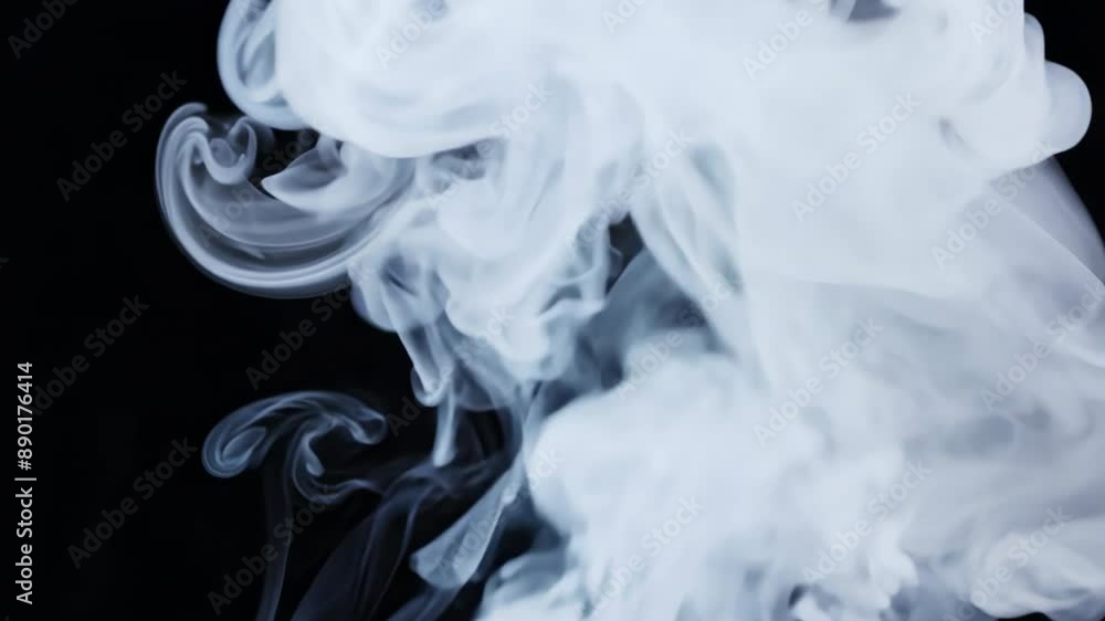 Abstract white smoke swirling against black background Abstract white smoke swirling against black background