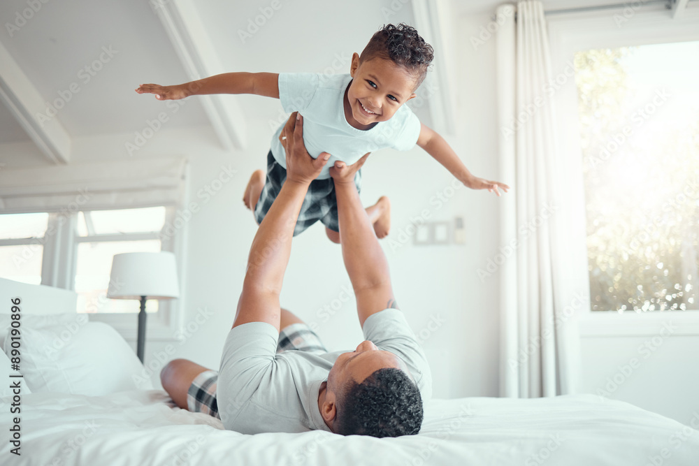 Dad, boy and happy with flying in bed at home for fun to relax, bonding and care in Brazil. People, parent and kid in bedroom with playing for support, child development and childhood memories Dad, boy and happy with flying in bed at home for fun to relax, bonding and care in Brazil. People, parent and kid in bedroom with playing for support, child development and childhood memories