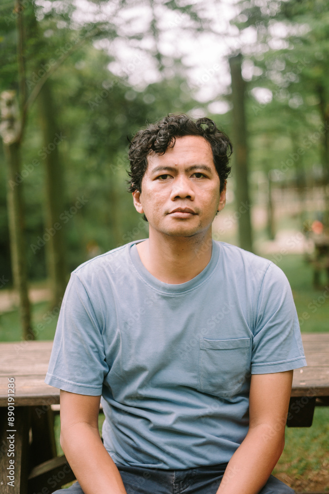 An Asian man with a blank stare, capturing an expression of contemplation or emptiness, perfect for emotional An Asian man with a blank stare, capturing an expression of contemplation or emptiness, perfect for emotional