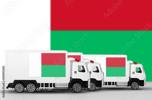 Madagascar flag depicted on side wall of white delivery van close up. Shipping and local delivery concept