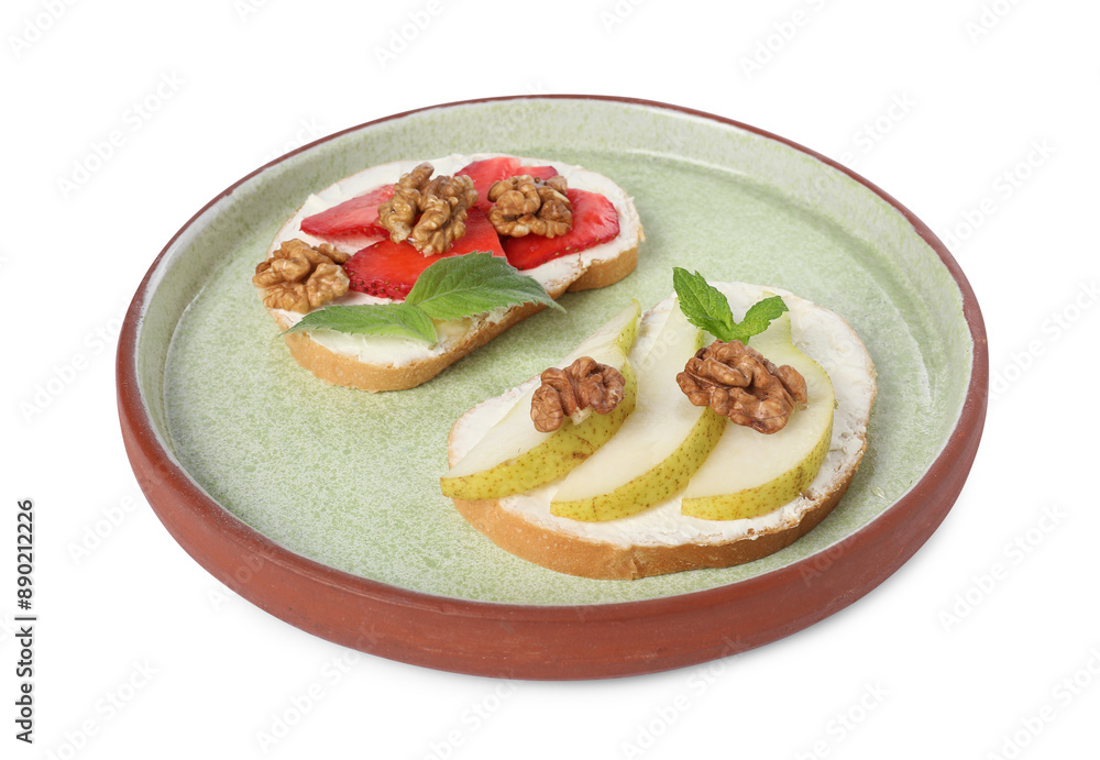 Delicious bruschettas with ricotta cheese, pear, strawberries, mint and walnuts isolated on white Delicious bruschettas with ricotta cheese, pear, strawberries, mint and walnuts isolated on white