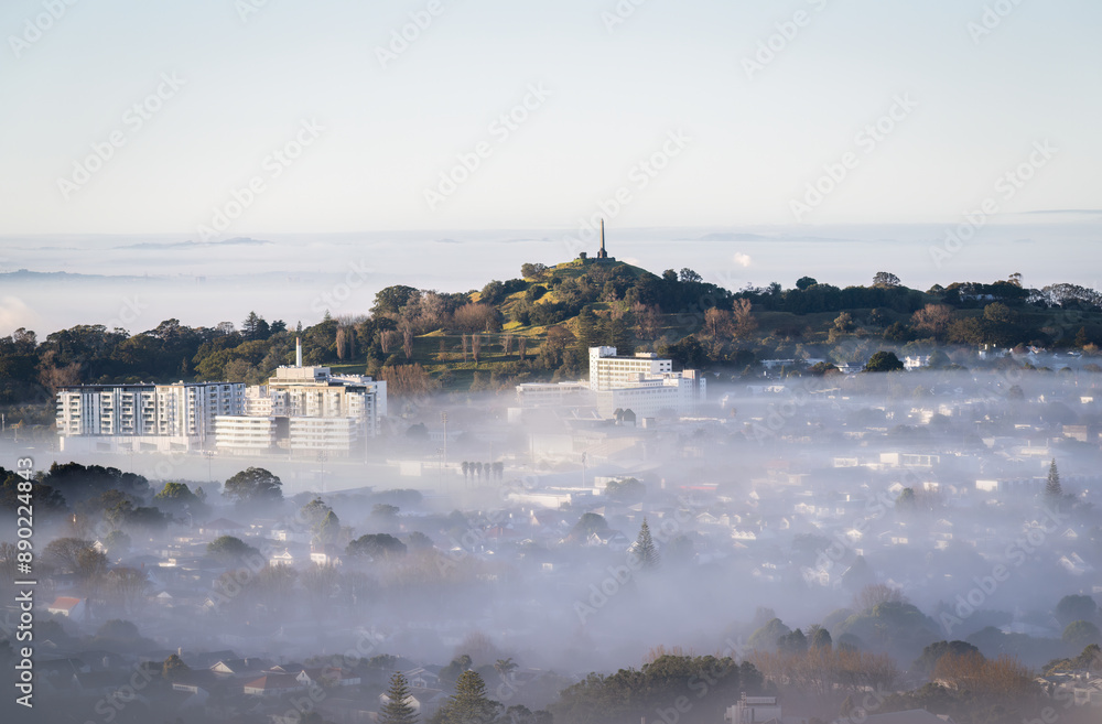 One Tree Hill above a sea of fog at sunrise. Auckland.
