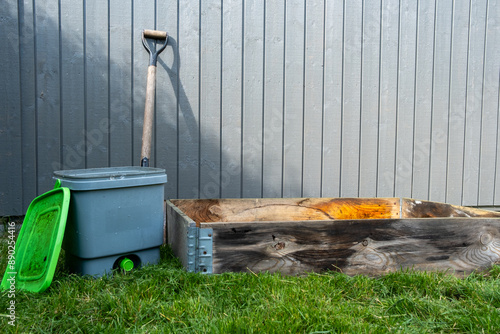 Bokashi bucket on the lawn with pallet for composting foodscraps to nutrient soil with bio char