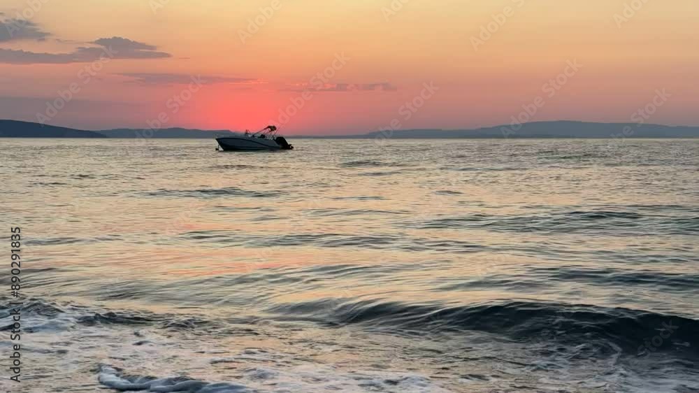 sunrise time lapse at the beach with silhouette of a boat sunrise time lapse at the beach with silhouette of a boat