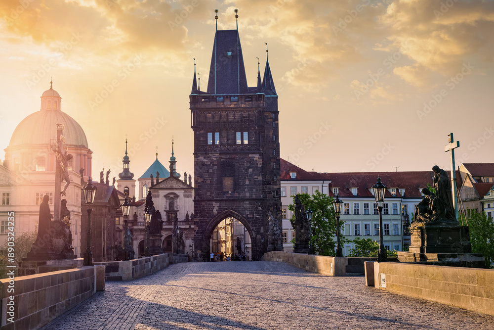 Fototapeta premium Charles bridge tower in Prague on sunrise, Czech Republic