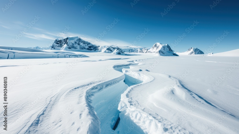 A stunning image of a vast snow-covered landscape featuring a deep crevasse, set against a backdrop of distant mountains under a clear blue sky in a winter setting. A stunning image of a vast snow-covered landscape featuring a deep crevasse, set against a backdrop of distant mountains under a clear blue sky in a winter setting.