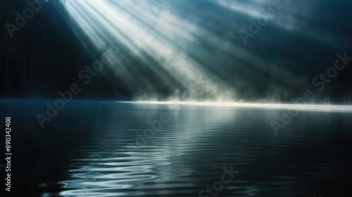 Sunlight beams penetrate through mist above a tranquil water surface, casting a serene and peaceful atmosphere in this tranquil natural landscape scene.