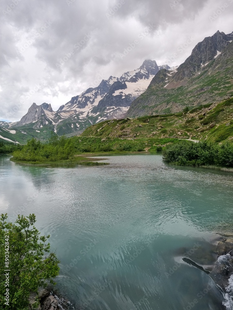 Fototapeta premium Courmayeur, Aosta Valley, Italy - Mont Blanc Massif. Combal lake and plateau, between Italy and France. In the background: Pyramides Calcaires.