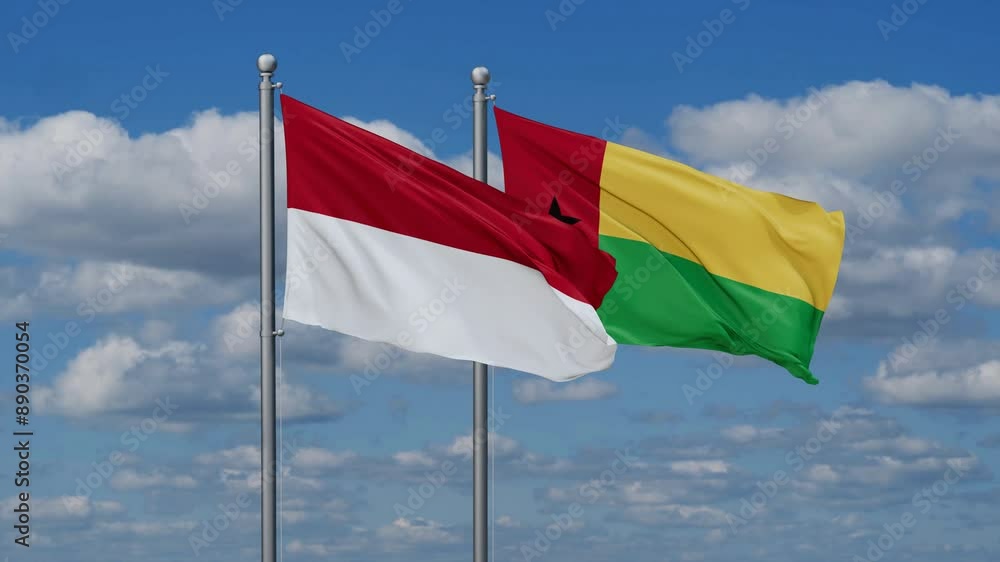 Guinea-Bissau and Indonesia flags flying together, video concept of the relationship, two country relations concept Guinea-Bissau and Indonesia flags flying together, video concept of the relationship, two country relations concept