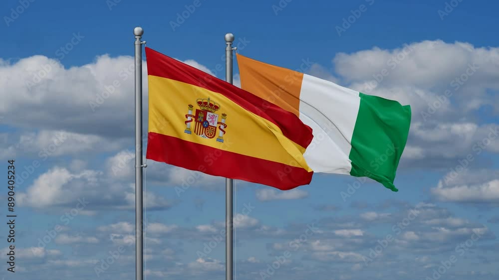 Ivory Coast or Cote d'Ivoire and Spain flags flying together, video concept of the relationship, two country cooperation concept Ivory Coast or Cote d'Ivoire and Spain flags flying together, video concept of the relationship, two country cooperation concept