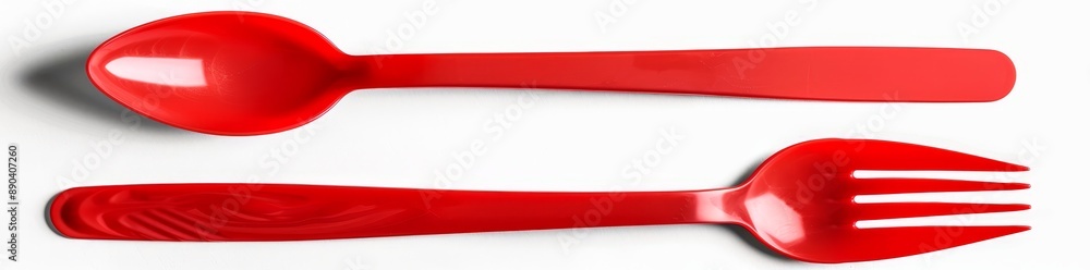 A red plastic spoon, knife, and fork with a transparent background. A red plastic spoon, knife, and fork with a transparent background.