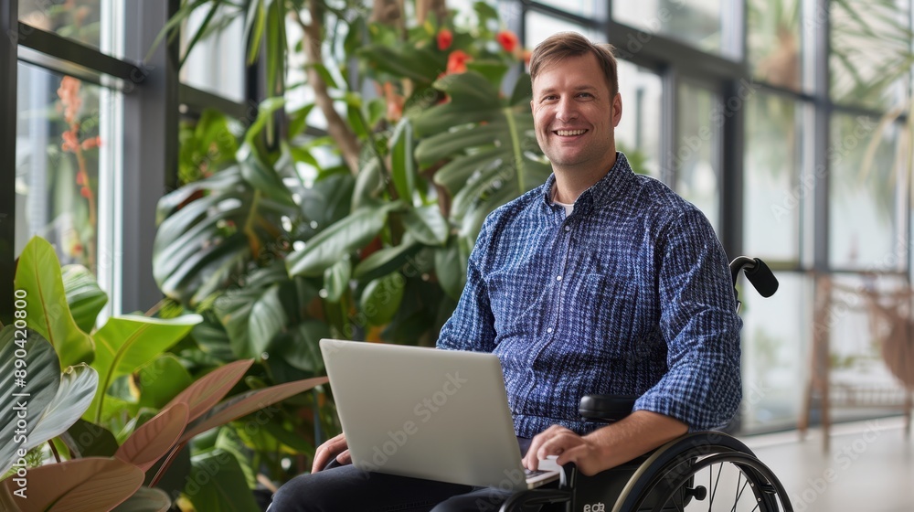 Man with laptop in wheelchair Man with laptop in wheelchair
