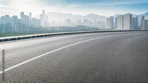 Wallpaper Mural Curved asphalt road leading to a modern city skyline. Urban landscape background with copy space Torontodigital.ca