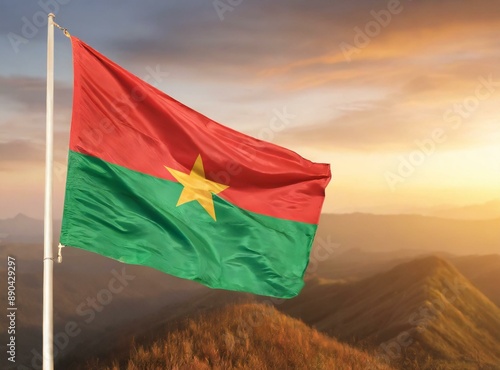 Burkina Faso flag waving outdoor on the country photo