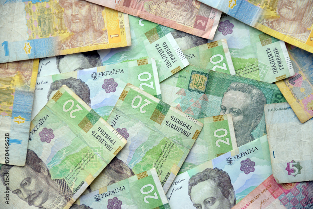 Processed collage of Ukrainian Hryvnia UAH bills banknotes texture. Background for banner Processed collage of Ukrainian Hryvnia UAH bills banknotes texture. Background for banner