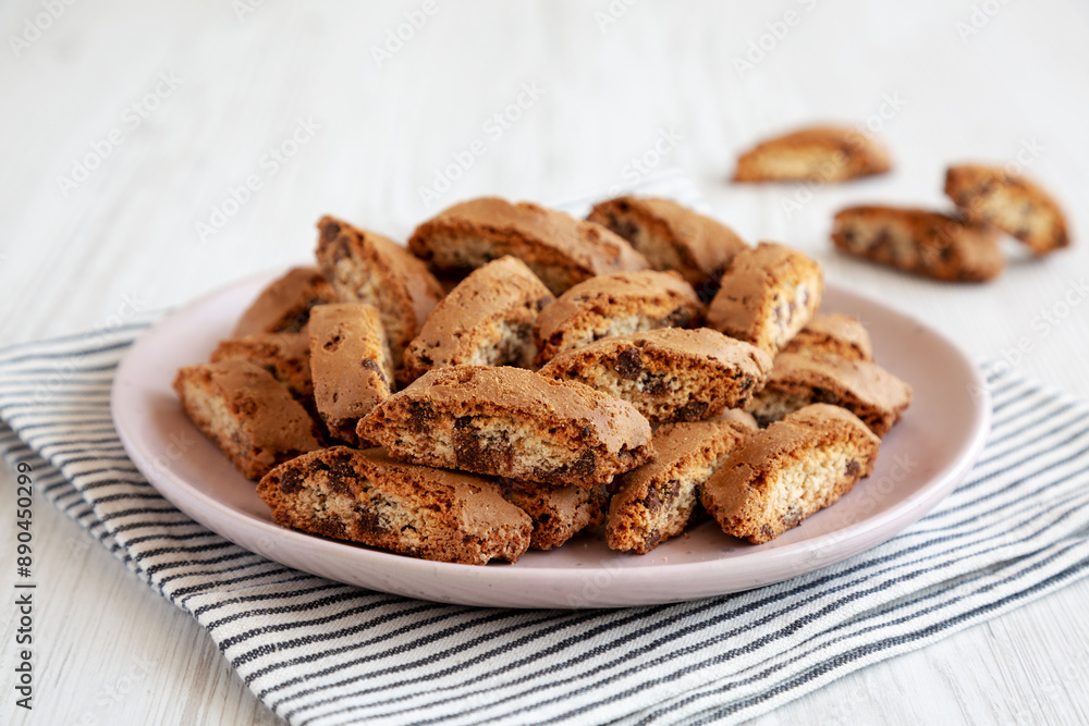 Homemade Cantuccini Cookies with Chocolate Chips on a Plate, low angle view. Homemade Cantuccini Cookies with Chocolate Chips on a Plate, low angle view.