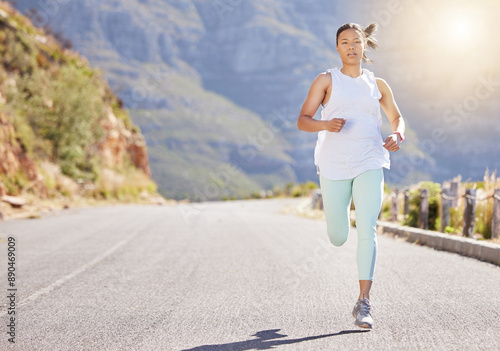 Woman. running and portrait in outdoor for fitness, or training, exercise and physical cardio for marathon. Female athlete, runner and practice for race on road, serious and endurance for workout.