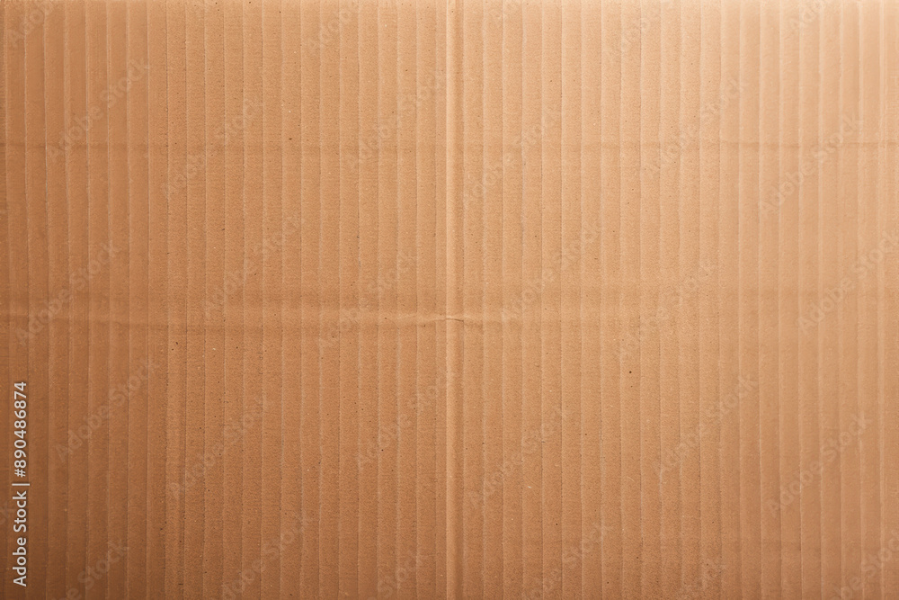 Close-up view of a textured brown cardboard surface, perfect for background or packaging themed projects. Neutral and ecologically friendly material. Close-up view of a textured brown cardboard surface, perfect for background or packaging themed projects. Neutral and ecologically friendly material.