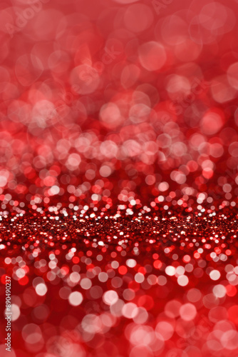 Abstract red bokeh background with sparkling lights, creating a festive and elegant atmosphere perfect for holiday-themed projects.