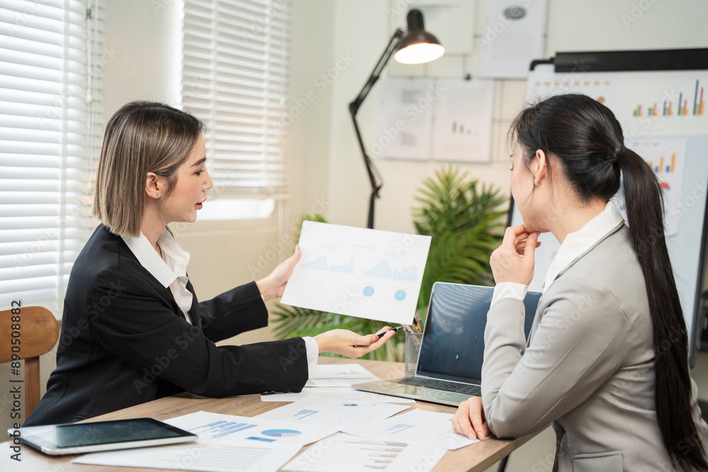 Asian business, women Talk about new projects, presents at home office. Asian business, women Talk about new projects, presents at home office.
