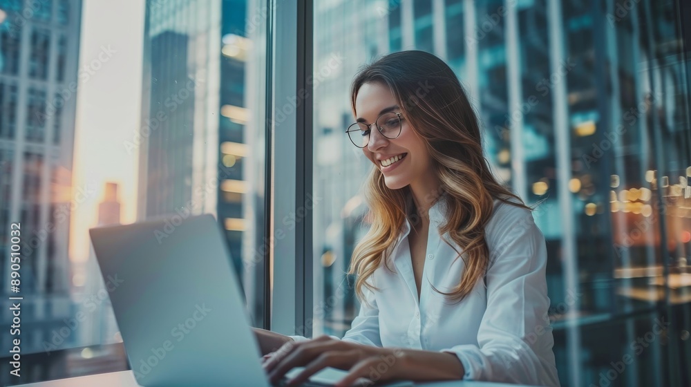 Beautiful smiling businesswoman typing on laptop Beautiful smiling businesswoman typing on laptop