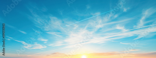 A photo of a clear blue sky with the setting sun. 