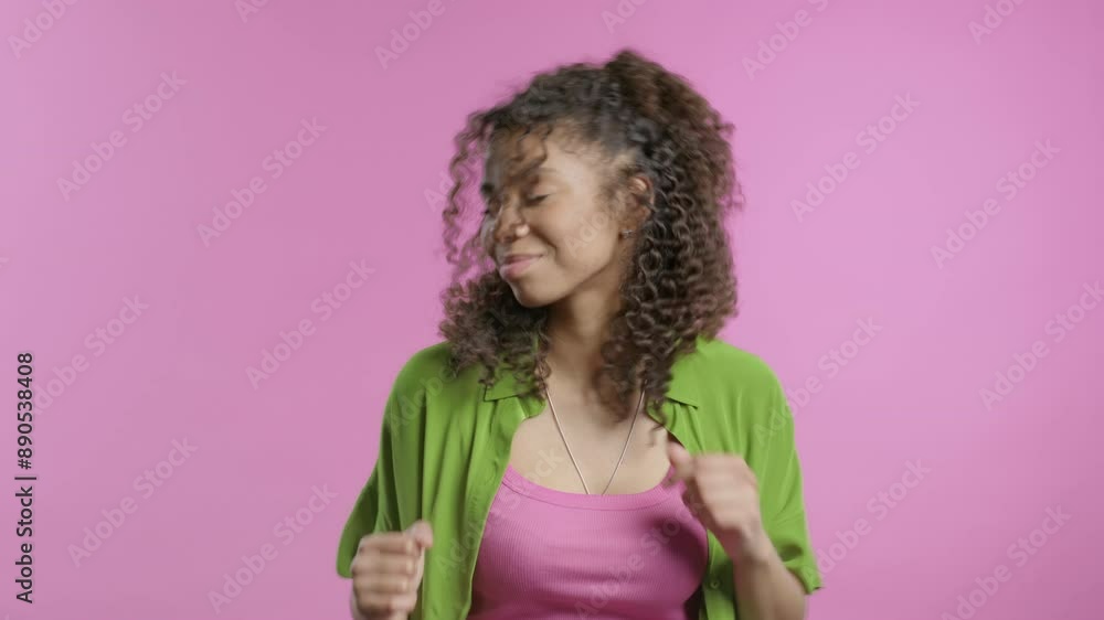 Happy african woman dancing on pink studio background. Favorite music, smiling Happy african woman dancing on pink studio background. Favorite music, smiling