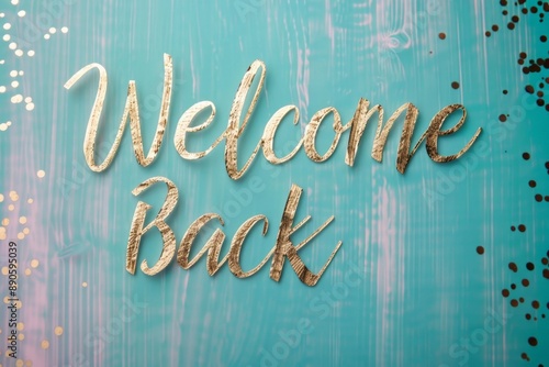 Welcome Back Celebration Greeting with Gold Lettering on Teal Background