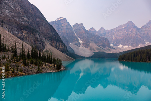 Lake Moraine Turquoise Water Mirror Surface with Canadian Rocky Mountains Behind, Banff, Alberta, Canada