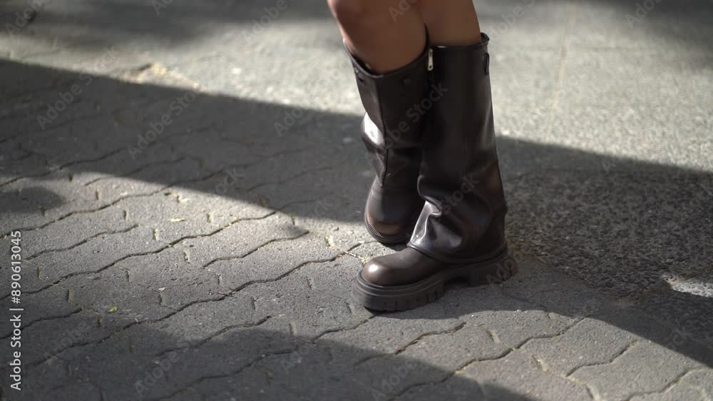 black woman walking on the street in cowboy shoes slow motion black woman walking on the street in cowboy shoes slow motion