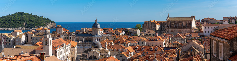 Panoramic view over the red roofs of the city of Dubrovnik. Shoot from the city walls of the old city. Panoramic view over the red roofs of the city of Dubrovnik. Shoot from the city walls of the old city.
