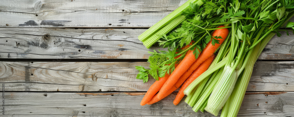 Fresh carrots, celery, and herbs arranged on distressed wooden planks. The bright colors of the vegetables contrast beautifully with the aged wood. Fresh carrots, celery, and herbs arranged on distressed wooden planks. The bright colors of the vegetables contrast beautifully with the aged wood.