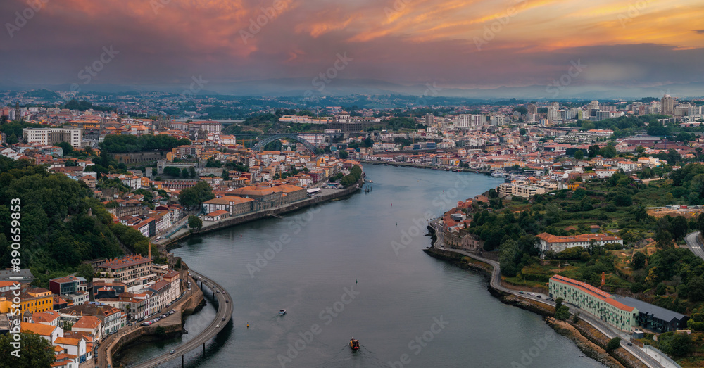 Fototapeta premium Aerial view of the European city Porto with Luis I Bridge over Douro river in Portugal, aerial view. Panoramic aerial view of Dom Luis Bridge in Porto