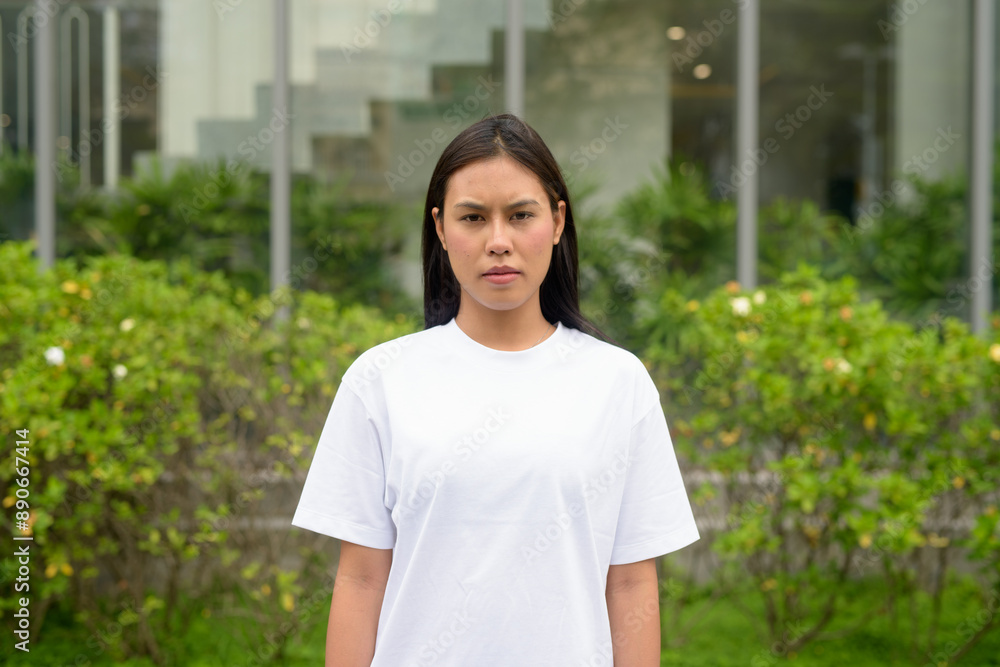 Young Thai Woman Outdoors in Casual Clothing Young Thai Woman Outdoors in Casual Clothing
