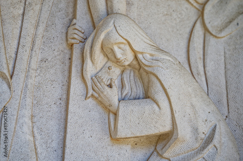 Mary Magdalene at the foot of the cross. Jesus dies on the cross – Station XII of the Way of the Cross. Valinhos (Fátima), Portugal. photo