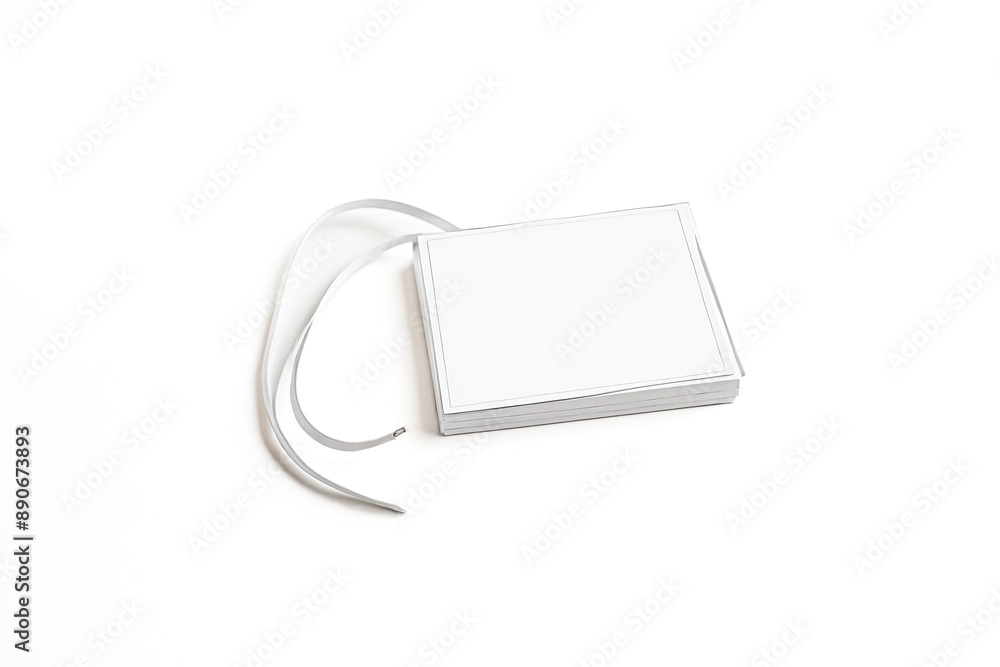 Stack of Blank White Paper Cards with a White Ribbon Stack of Blank White Paper Cards with a White Ribbon