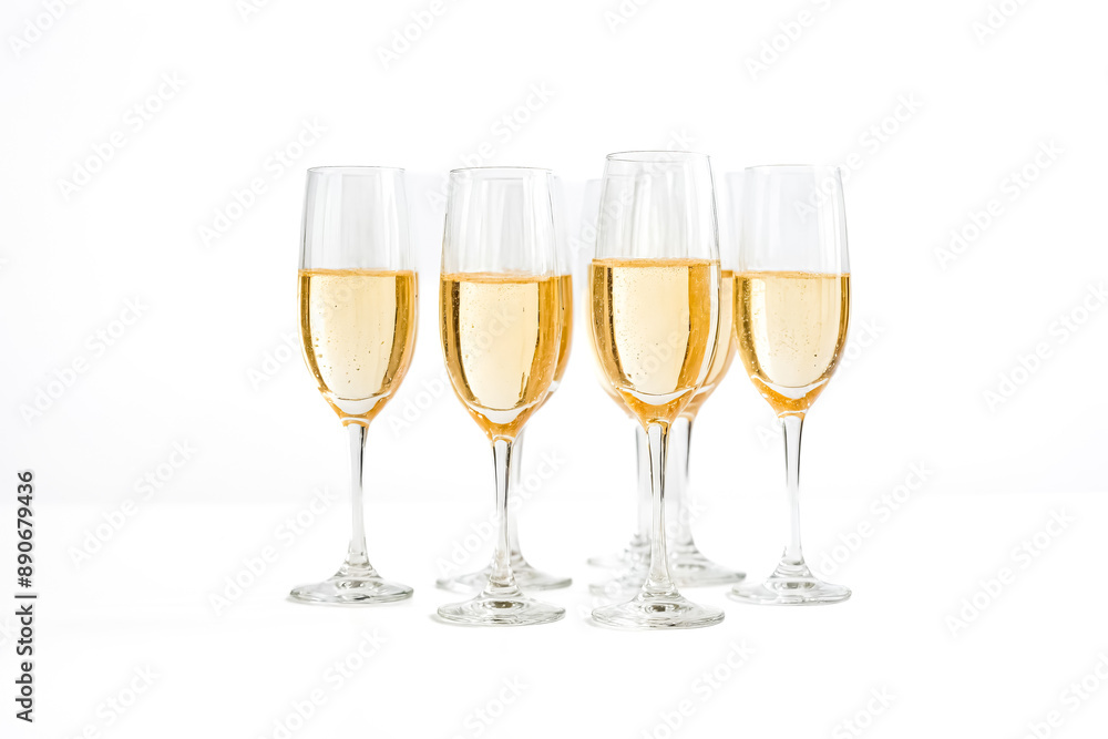 Champagne flutes filled with sparkling wine on a white background Champagne flutes filled with sparkling wine on a white background