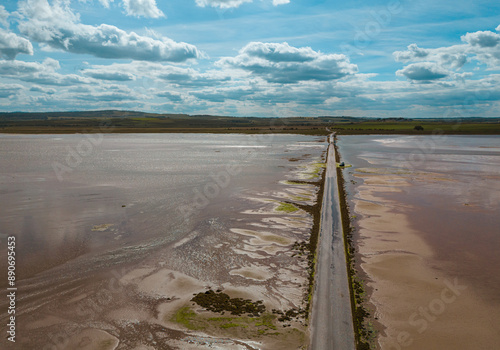 Lindisfarne, Northumberland, UK, June 19, 2024; high level aerial view to the west of Lindisfarne Causeway, Holy Island, Northumberland, England, UK. photo