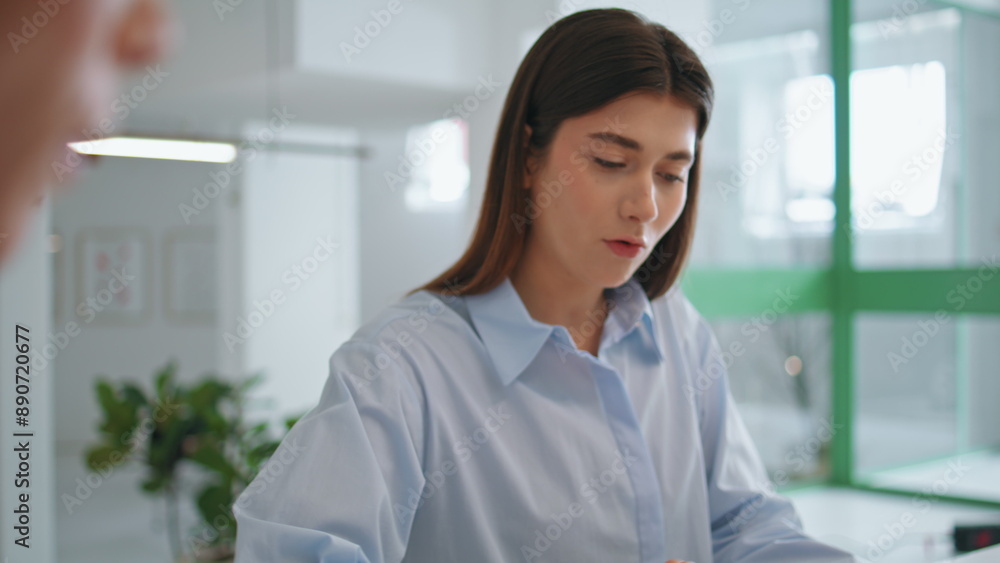 Business partner sign contract deal closeup. Young girl client checking document Business partner sign contract deal closeup. Young girl client checking document