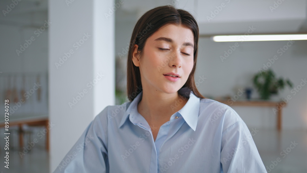 Portrait creative designer looking camera. Smiling young brunette working office Portrait creative designer looking camera. Smiling young brunette working office