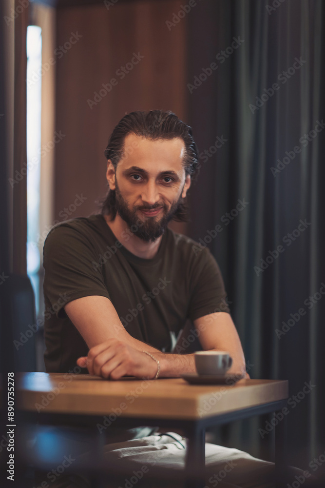 smiling young bearded man holding coffee cup espresso. man drinking morning fresh expresso coffee. smiling young bearded man holding coffee cup espresso. man drinking morning fresh expresso coffee.