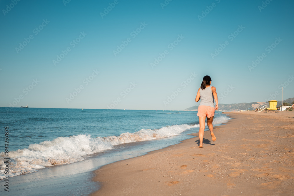 Woman embracing a healthy lifestyle with a beach run. Woman embracing a healthy lifestyle with a beach run.