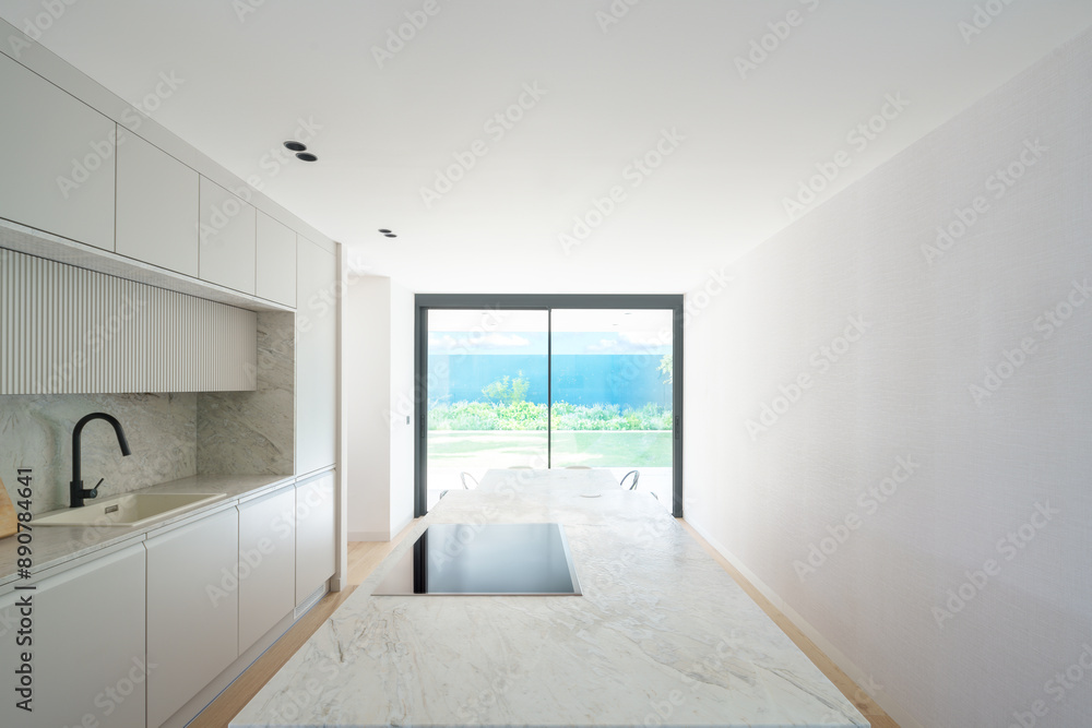 Modern minimalist kitchen in a 21st century design house Modern minimalist kitchen in a 21st century design house