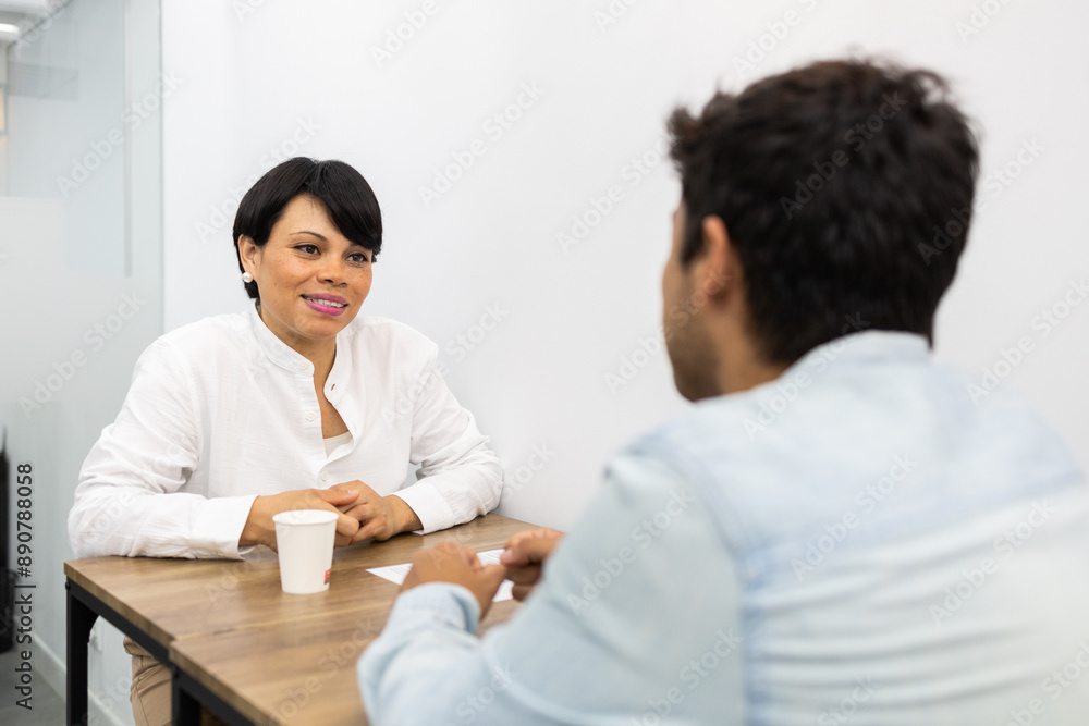 Interactive meeting between two colleagues at a table Interactive meeting between two colleagues at a table