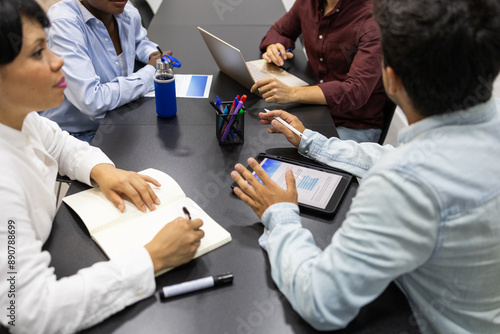 Diverse team collaborates in an English academy classroom