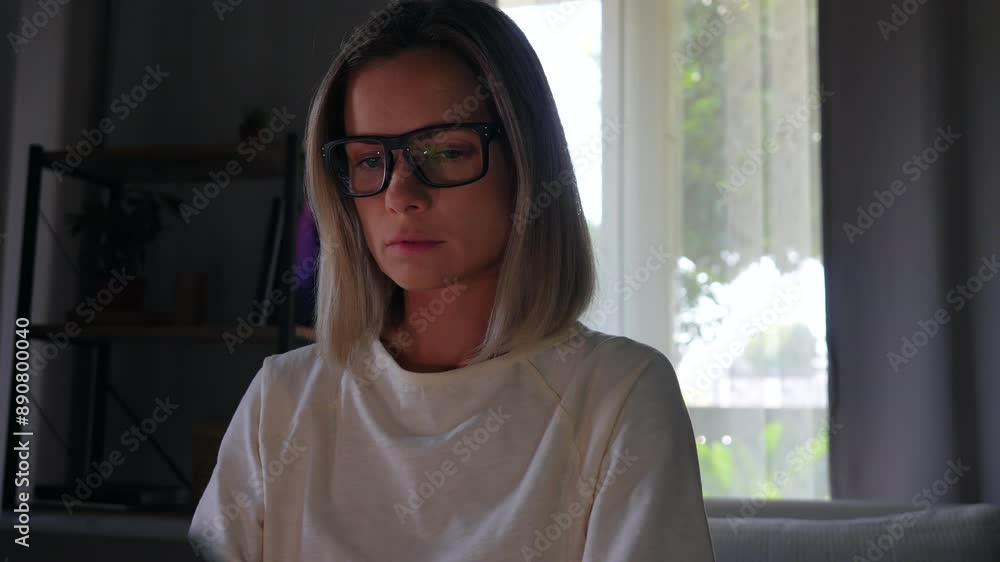 Woman in glasses working at home with computer Woman in glasses working at home with computer