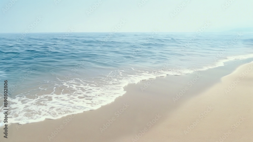 Peaceful beach scene with gentle waves meeting the sandy shore. Peaceful beach scene with gentle waves meeting the sandy shore.