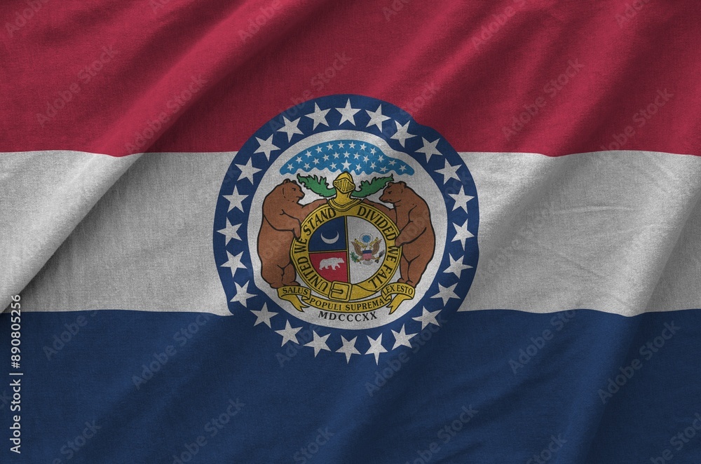 Missouri US state flag depicted on folded wavy fabric of old cloth close up Missouri US state flag depicted on folded wavy fabric of old cloth close up