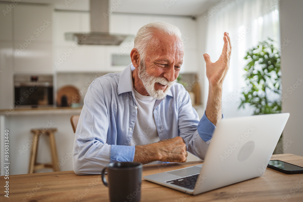 Senior caucasian man have a video call on laptop at home Senior caucasian man have a video call on laptop at home